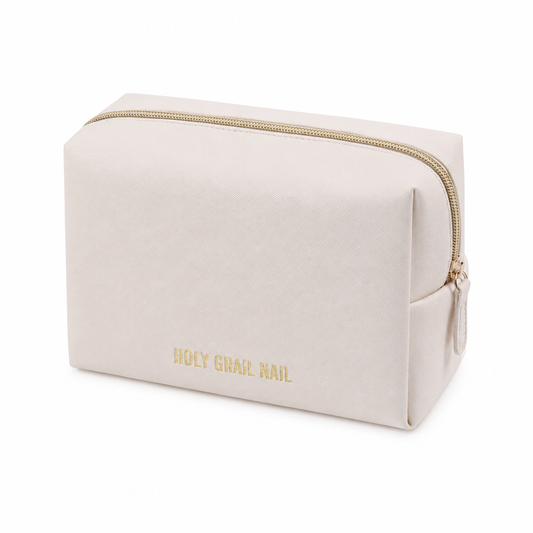 Beige saffiano-textured makeup bag with gold zipper and Holy Grail Nail logo