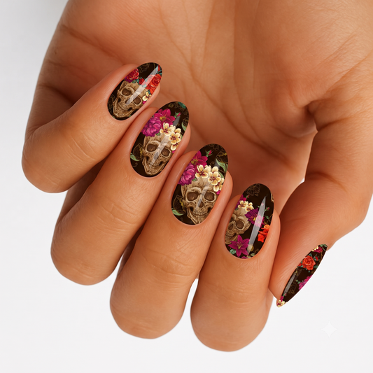 Black nail wraps with sugar skull and floral sugar skull art, red, pink, and gold florals