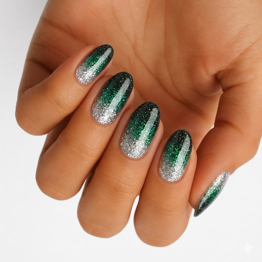Glittery emerald green to silver ombré nail wraps with glossy almond tips
