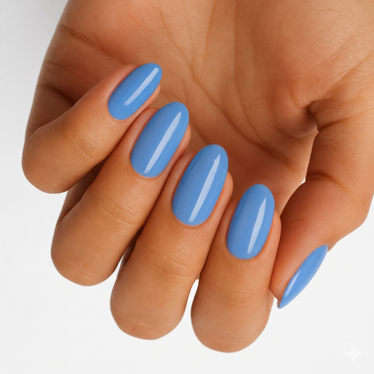 Sky blue glossy nail wraps in a solid colour on almond-shaped nails