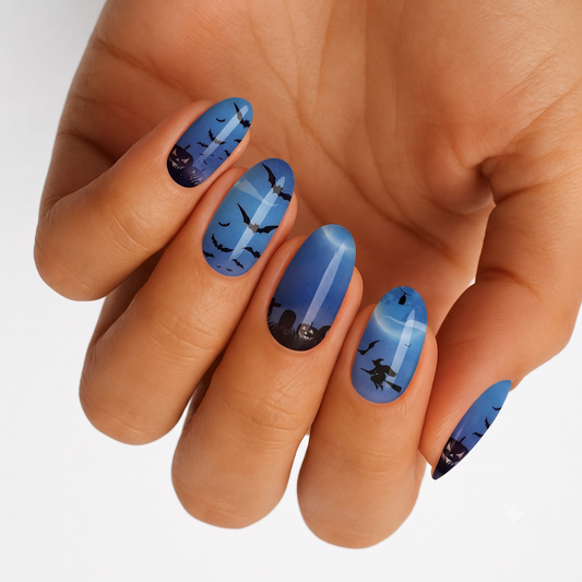Blue moonlit nail wraps with bat, witch and pumpkin Halloween silhouettes