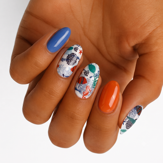 Glossy nail wraps with blue, orange solids and white sea creature print nails
