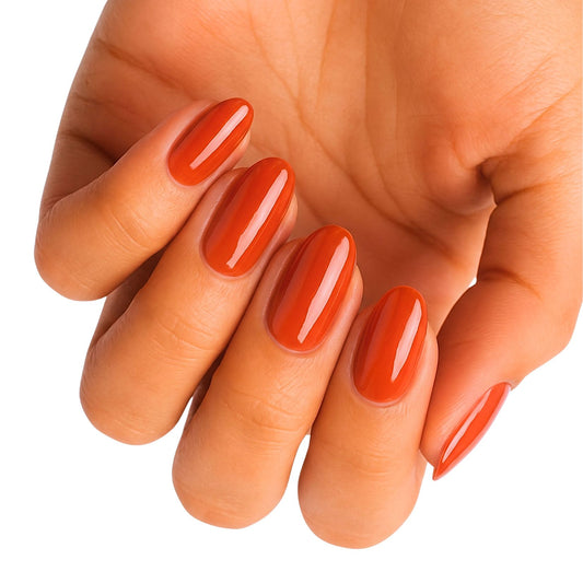 Glossy rust-orange nail wraps in a glossy finish on almond-shaped nails, wide fit.