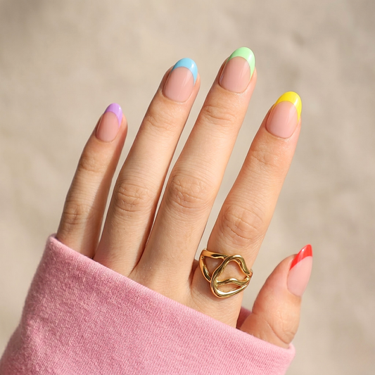 Short oval soft gel press-on nails, nude base with multicoloured French tip design