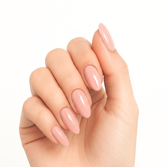 Nude pink glossy semi-cured gel nail wraps on almond-shaped nails