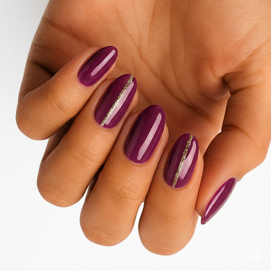 Glossy deep plum nail wraps with a thin gold glitter vertical stripe accent