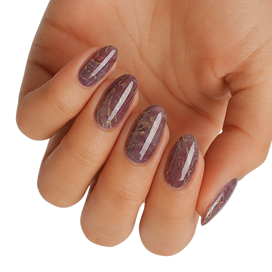 Plum marble nail wraps with gold glitter veining, glossy finish on oval nails