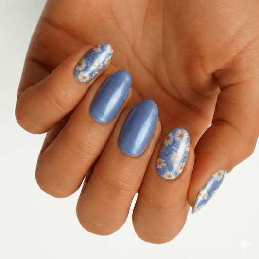 Blue shimmer nail wraps with white daisy floral accent nails, oval shape