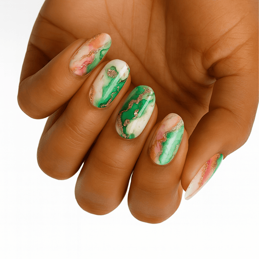 Green marble nail wraps with gold foil accents on hand showcasing elegant nail art