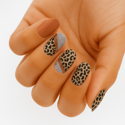 Leopard print nail wraps in brown and grey animal pattern on hand manicure