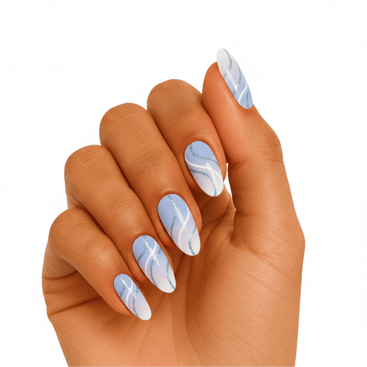 Blue marble effect gel nail wraps on hand showing flowing wave pattern