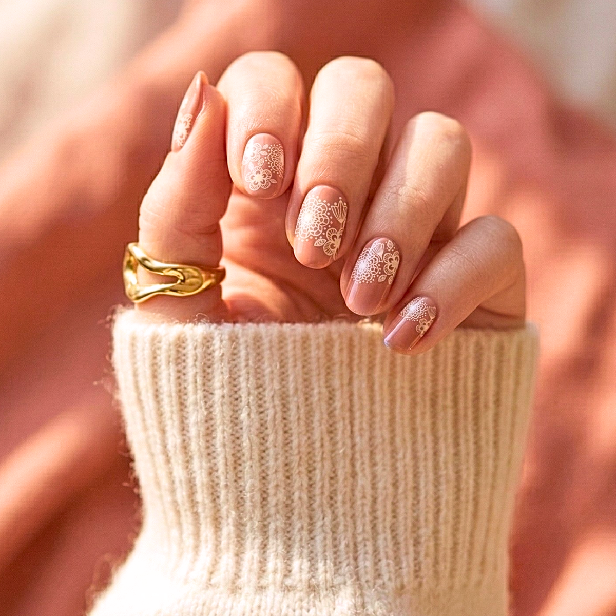Nude nail wraps with delicate white lace and floral mandala pattern