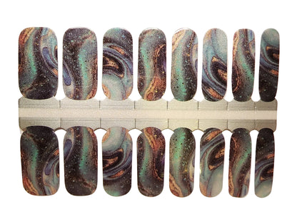 Holy Classics nail wraps in black, teal and copper marbled oil-slick swirl design