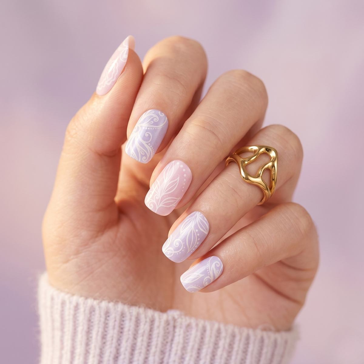 Lavender and nude nail wraps with glossy white lace and leaf swirl designs