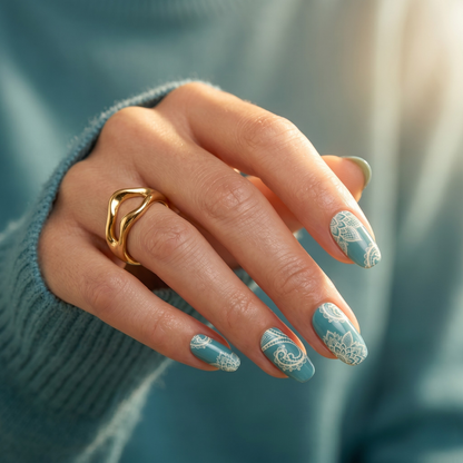 Dusty blue nail wraps with white mandala lace and paisley pattern on almond nails