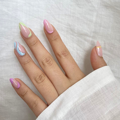 Short almond soft gel press-on nails, nude base with pastel green, blue and pink swirl edges