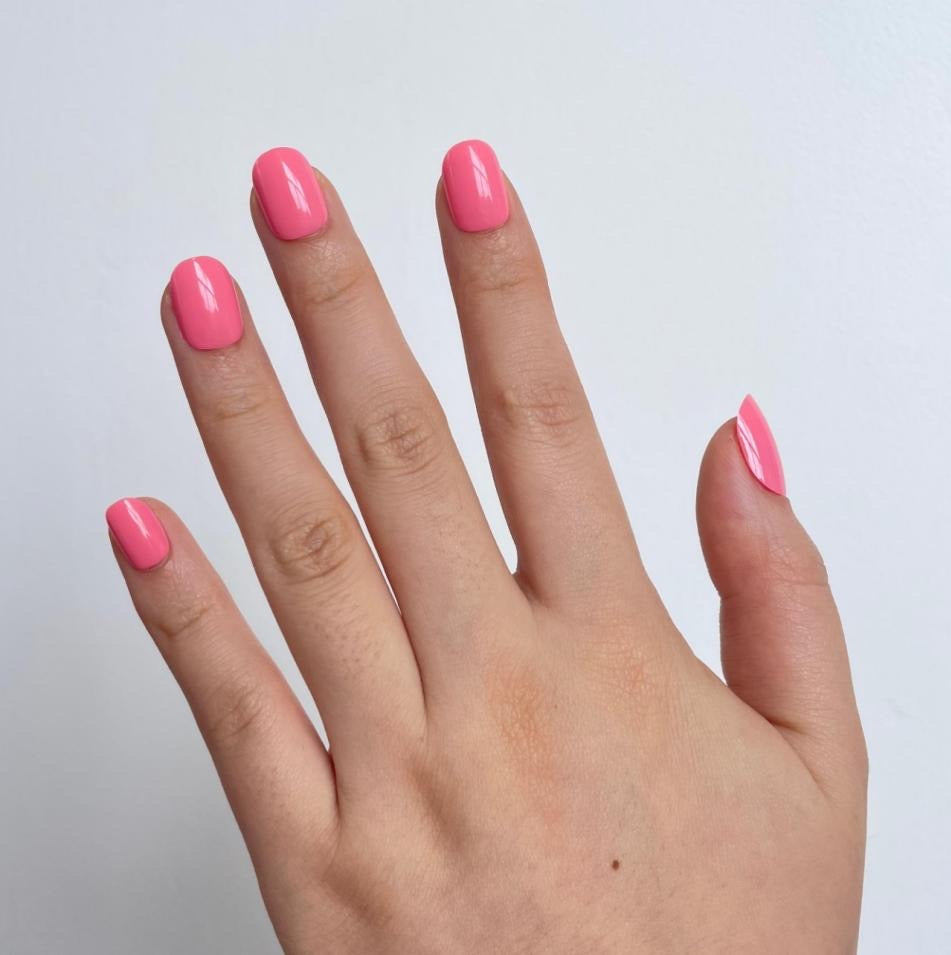 Bubblegum pink glossy soft gel press-on nails, extra short natural shape.