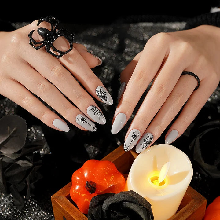 Grey semi-cured gel nail wraps with black spider and spiderweb Halloween design
