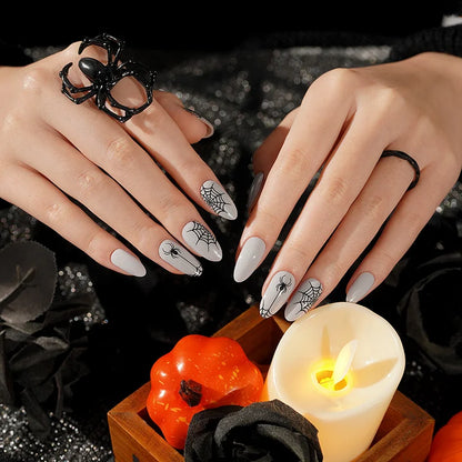 Grey semi-cured gel nail wraps with black spider and spiderweb Halloween design