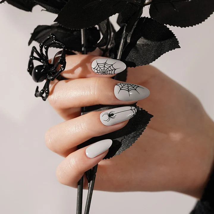 Grey semi-cured gel nail wraps with black spiderweb and spider Halloween design