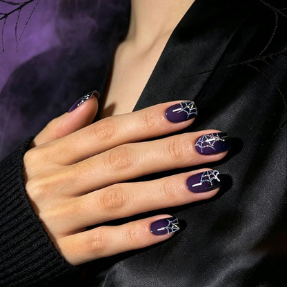 Deep purple glossy semi-cured gel nail wraps with silver glitter spiderweb design, Halloween style