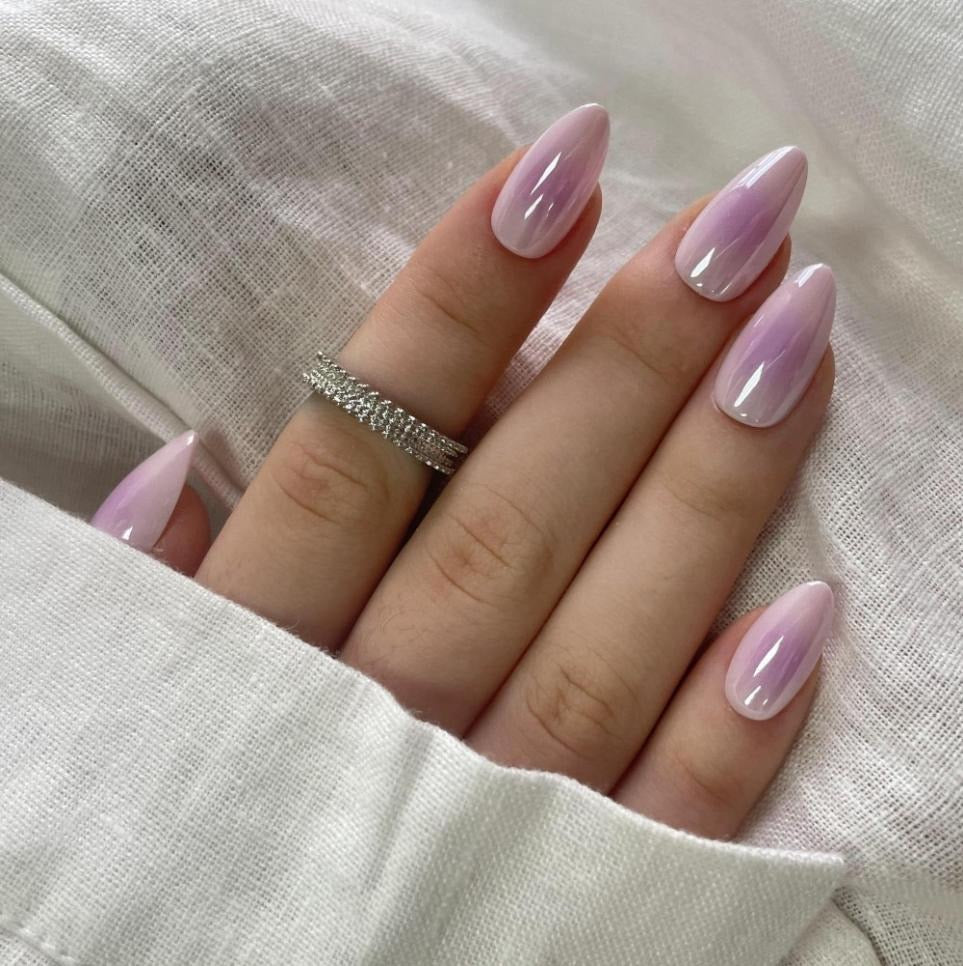 Soft gel press-ons in glossy lilac-pink glazed marble, short almond shape
