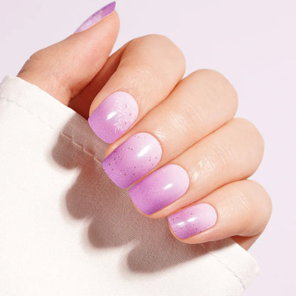 Purple ombre semi-cured gel nail wraps with glitter accents and floral tone-on-tone design