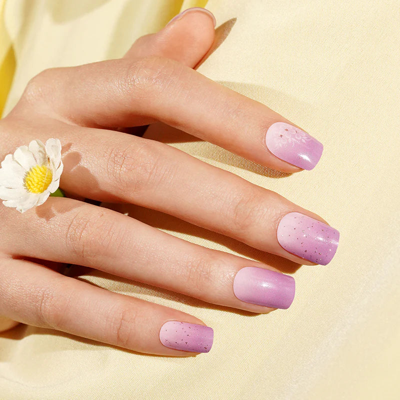 Lilac purple semi-cured gel nail wraps with glitter accents and white floral detail