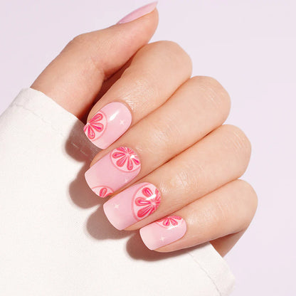 Pink semi-cured gel nail wraps with glossy pink citrus slice design on short square nails