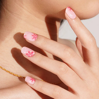 Pink semi-cured gel nail wraps with glossy pink citrus grapefruit slice design