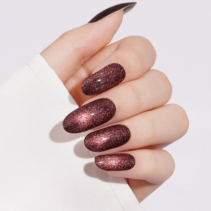 Deep burgundy cat's eye semi-cured gel nail wraps with shimmering magnetic finish, almond shape