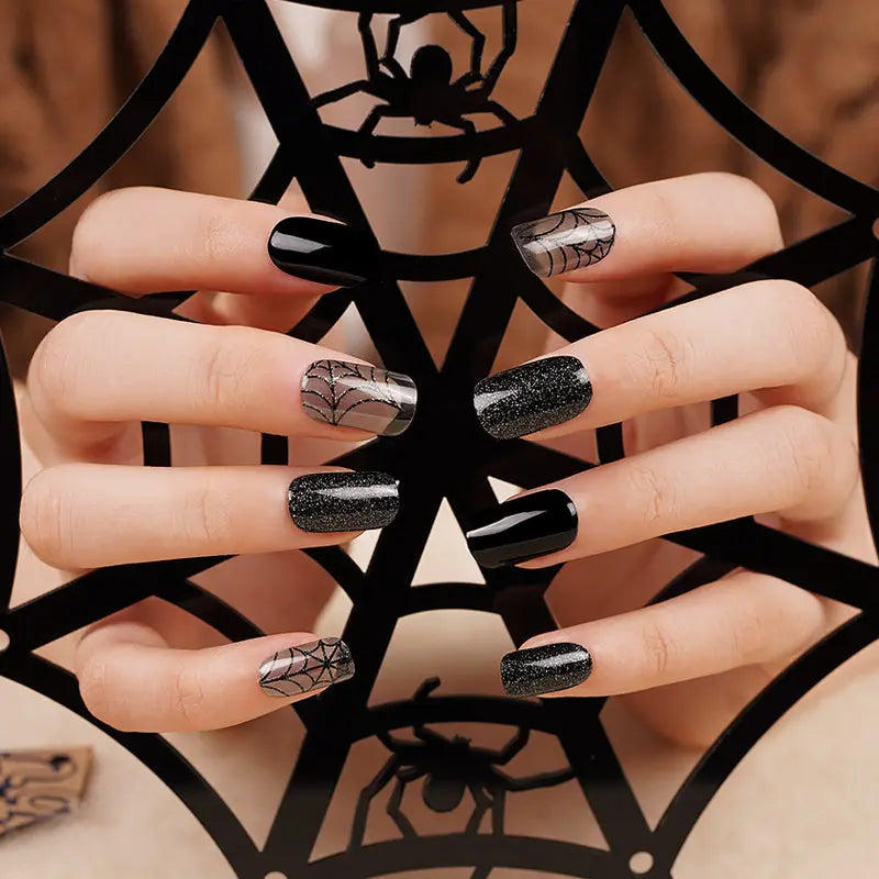 Black semi-cured gel wraps with glitter, glossy and sheer cobweb-print Halloween accents