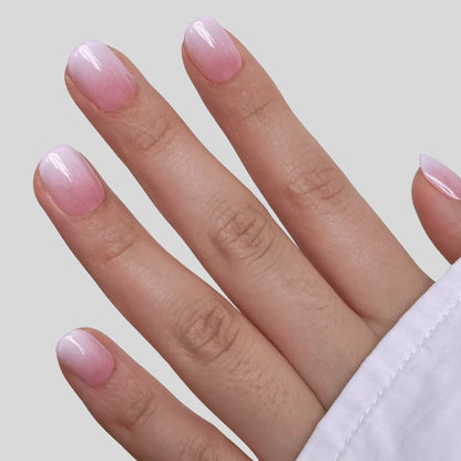 Soft gel press-ons, short round, glazed pink-to-white ombré with glossy finish