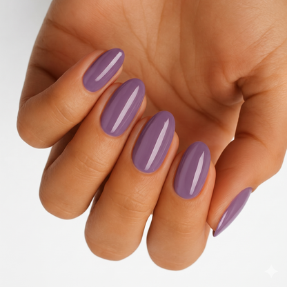 Dusty plum purple glossy nail wraps on medium skin tone, round almond shape