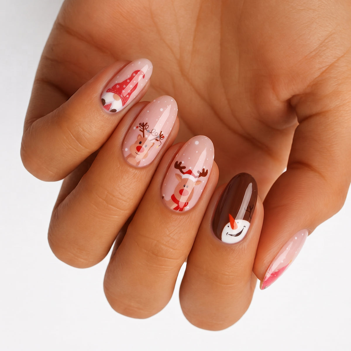 Holy Classics nail wraps, nude base with reindeer, snowman and Santa hat Christmas motifs