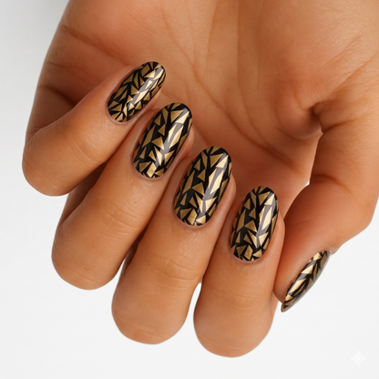Black nail wraps with metallic gold shattered-glass geometric triangle pattern