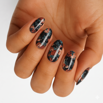 Black nail wraps with rust-toned floral print, glitter accents and silver lightning streak