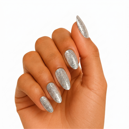 Silver glitter semi-cured gel wraps with sparkly full-coverage finish on almond-shaped nails