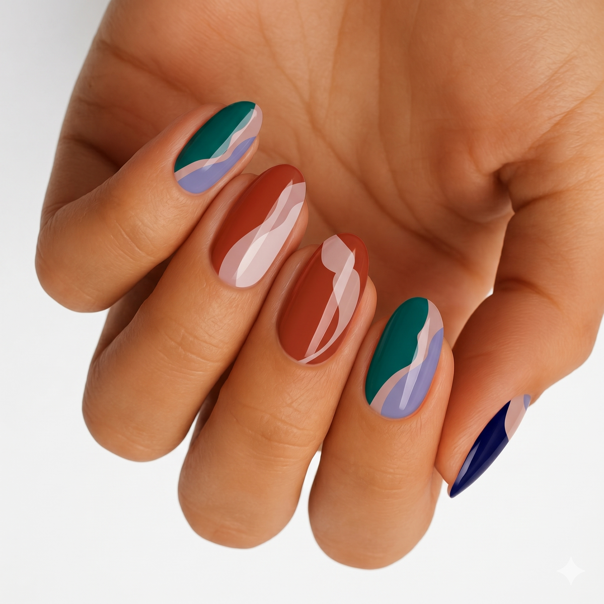 Glossy nail wraps with abstract colour-block swirls in teal, terracotta, navy and lilac.