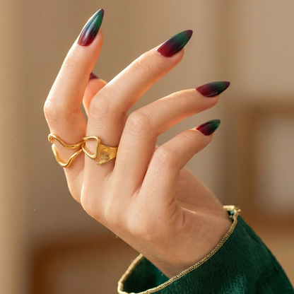 Almond-shaped nails with green-to-burgundy ombré, semi-cured gel wraps, glossy finish.