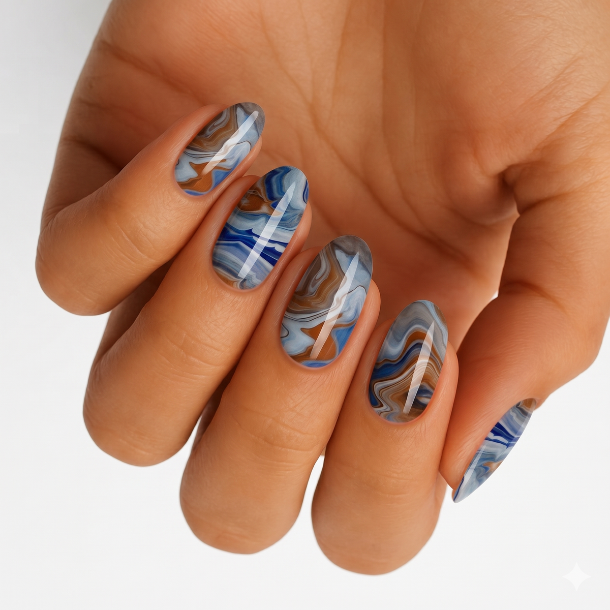 Nail wraps with blue, caramel and grey marbled swirl design, glossy finish