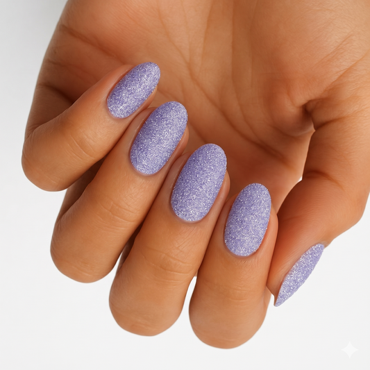 Lavender textured glitter nail wraps with a sparkly finish on almond-shaped nails