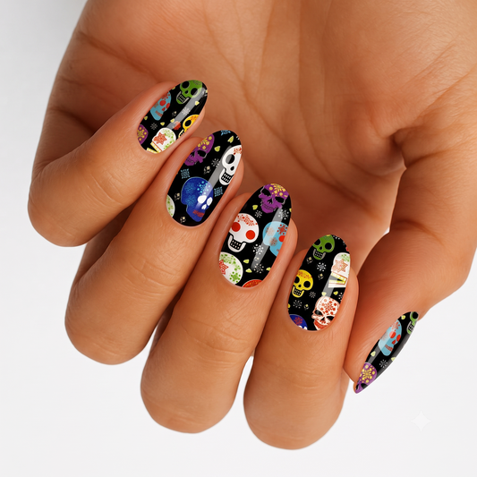 Black nail wraps with colourful Day of the Dead sugar skull designs and floral patterns