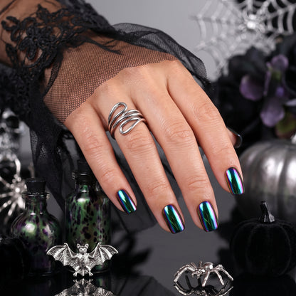 Short square soft gel press-ons in black with oil-slick chrome, blue-green-purple shift