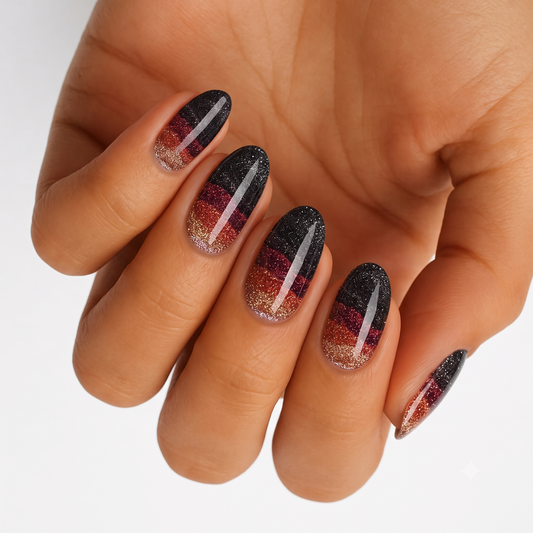 Black glitter nail wraps with burgundy and copper ombré bands and silver streak accent
