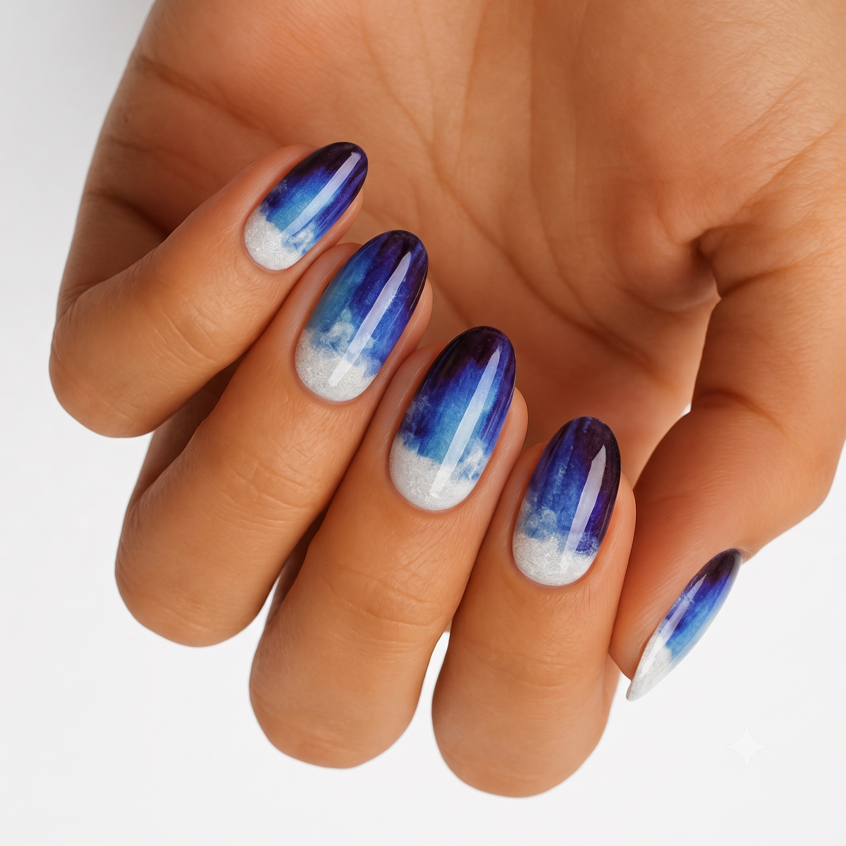 Navy-to-blue ombré nail wraps with glittery white tips, glossy misty cloud finish.