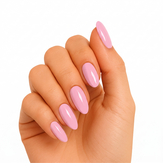 Glossy solid light pink semi-cured gel nail wraps on almond-shaped nails.