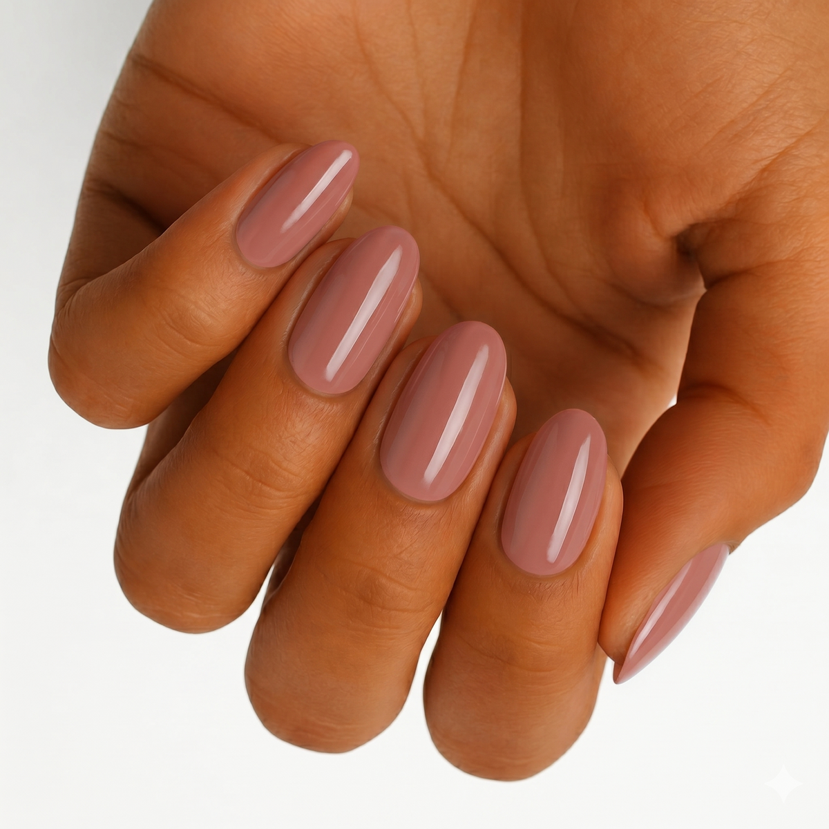 Dusty mauve-pink glossy nail wraps shown on almond-shaped nails, wide fit