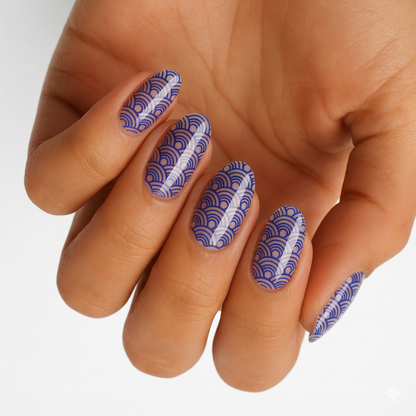 Blue scalloped wave pattern nail wraps on sheer background, glossy finish