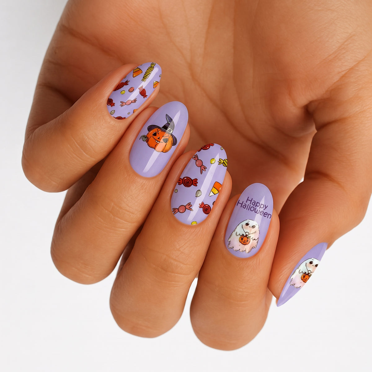 Lilac nail wraps with candy, pumpkin ghost and "Happy Halloween" text designs